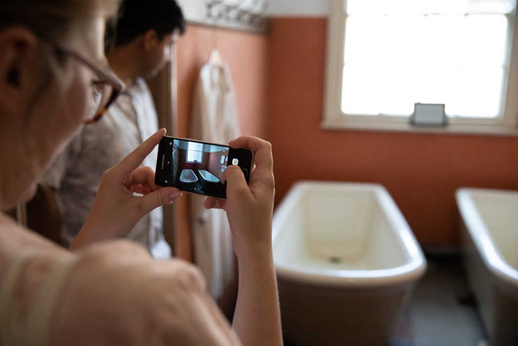 Visitors taking photos in the Workhouse Museum